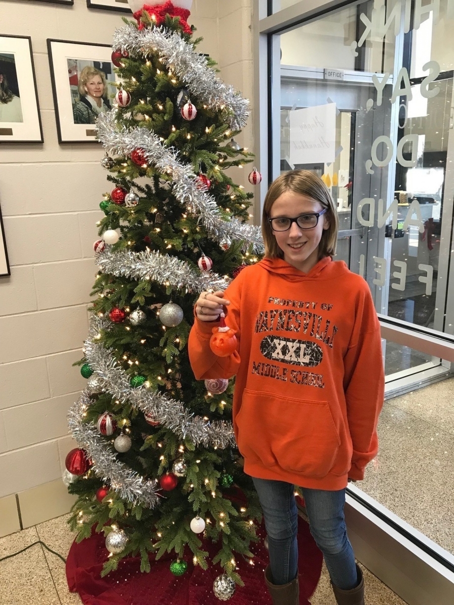 girl in front of a christmas tree